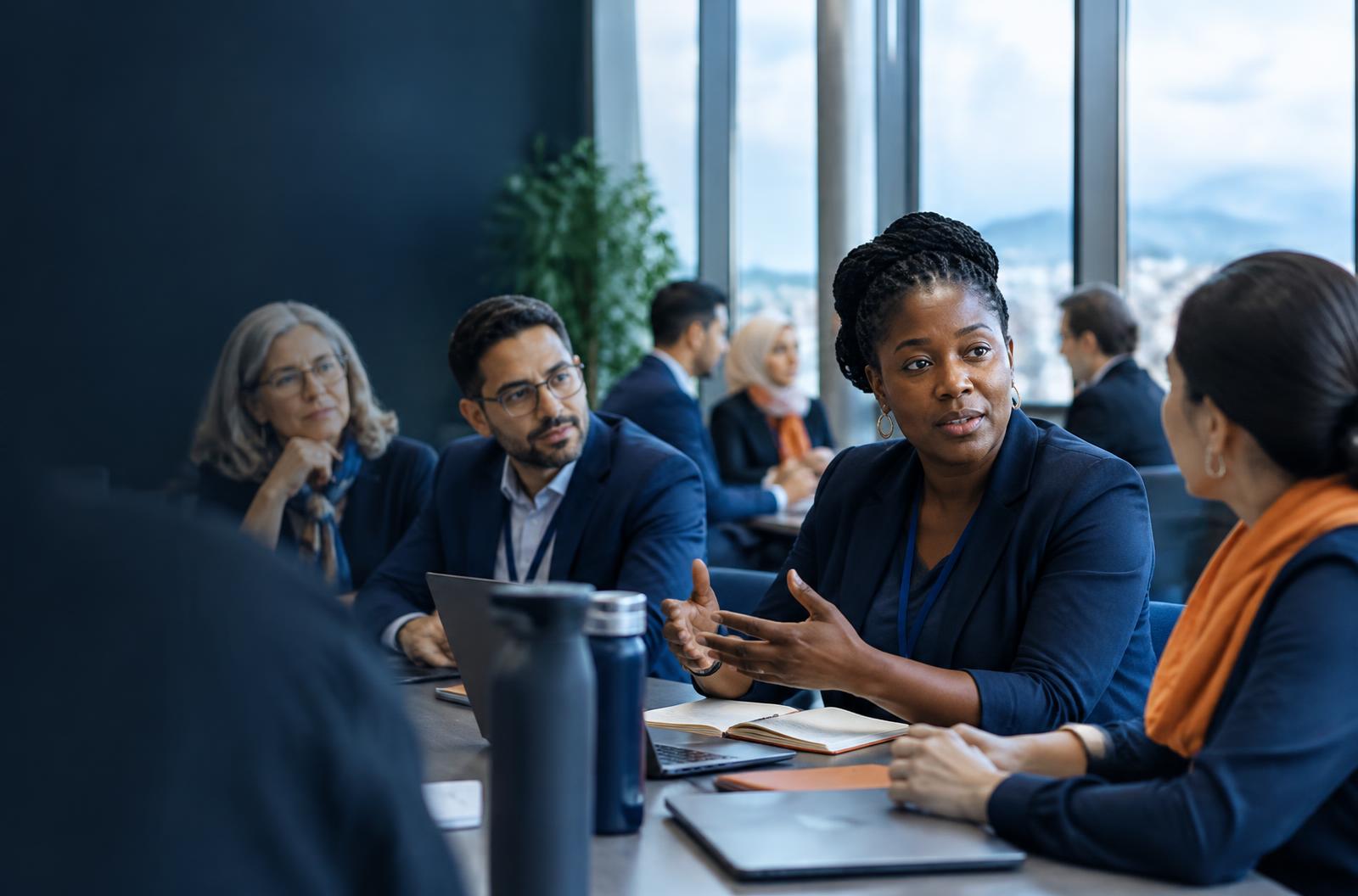 Education leaders in conversation around a table